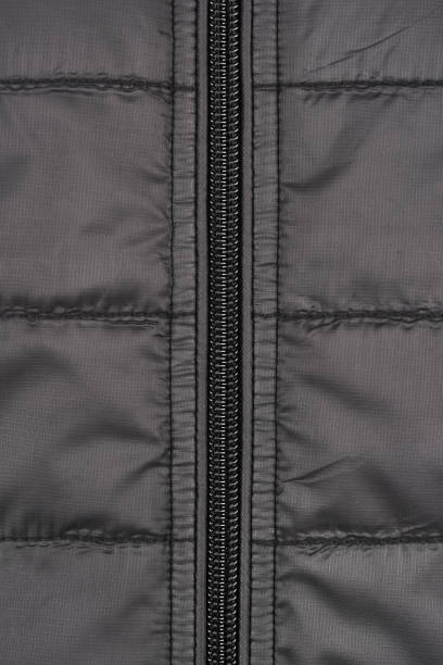 istock Close-up of a down jacket grey and zipper 1136755494