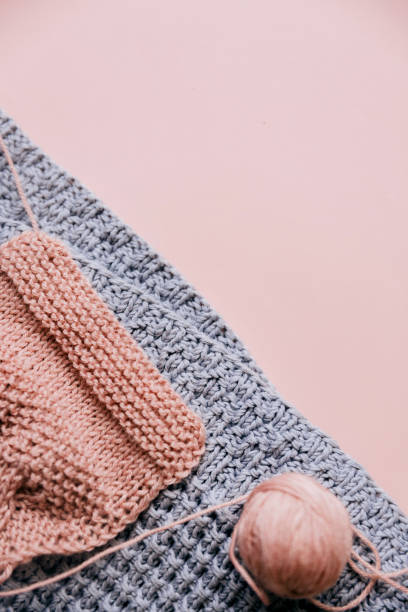 istock Yarn and knit on pink background 1136755720