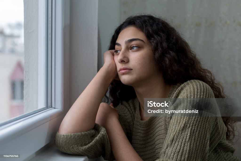 Sad unhappy teenage girl Teenager Stock Photo