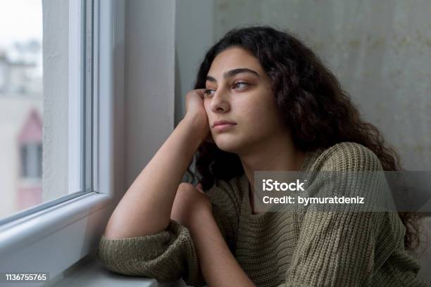 Sad Unhappy Teenage Girl Stock Photo - Download Image Now - Teenager, Sadness, Depression - Sadness