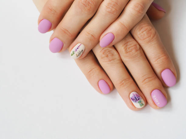 istock Fashionable lilac manicure design in the hand. 1136757526