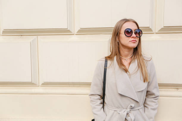 istock woman posing with sunglasses 1136759609