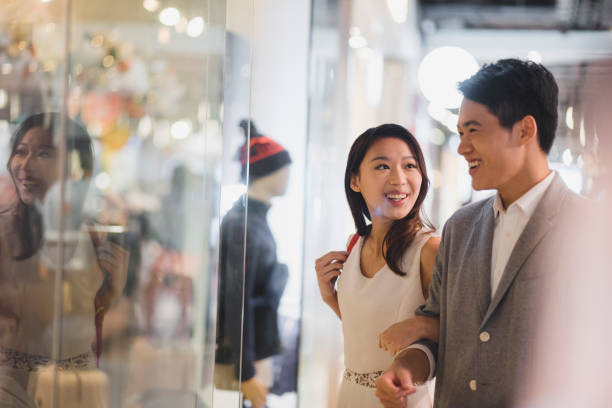 istock Young Chinese couple in the shopping centre 1136762014