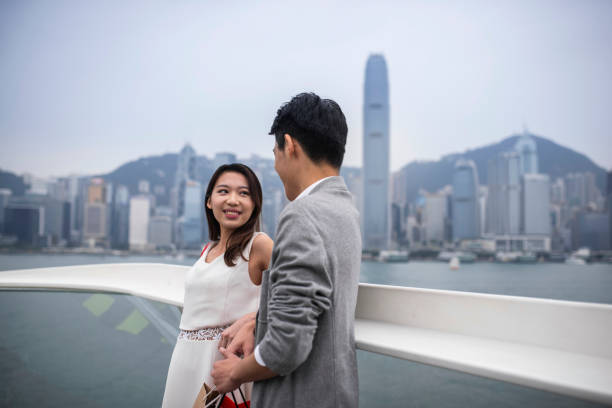 istock Young Chinese couple talking outdoors 1136762021