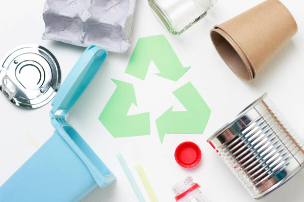 istock Green recycle garbage symbol and plastic, iron garbage on white background, top view. 1136764557