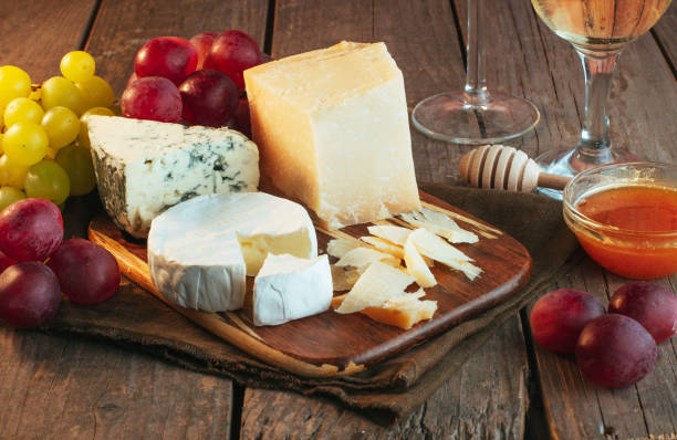 istock Various types of cheese on wooden cutting board 1136764969