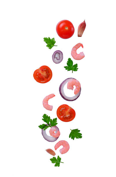istock Cherry tomatoes, shrimps, onion and parsley isolated on white 1136765789