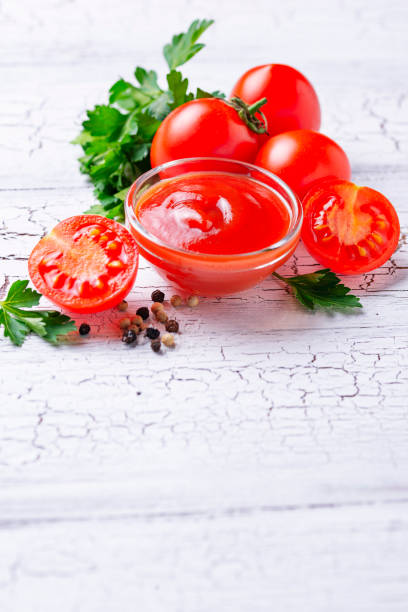 istock Tomato ketchup sauce on wooden background 1136766017