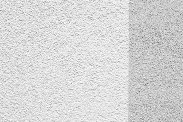 istock Grey white dividing line plastered wall background wallpaper with copy space. 1136766110