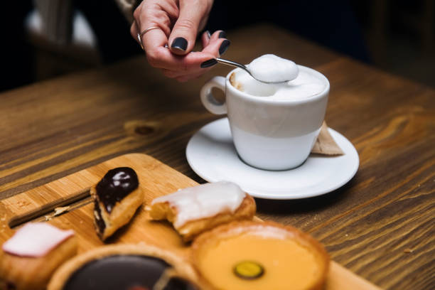 istock Cup of coffee cappuccino in woman hands 1136773236