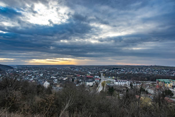 istock Clouds in the sunset sky over the city 1136773683