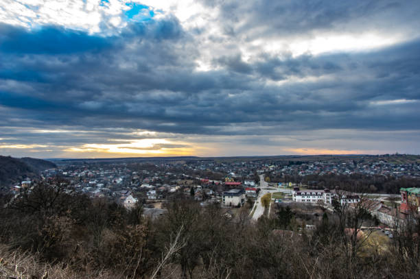 istock Clouds in the sunset sky over the city 1136773730