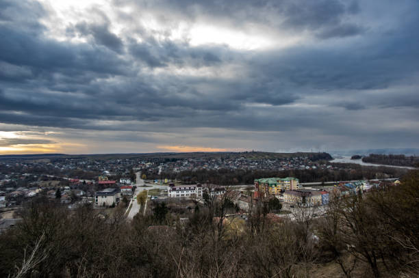 istock Clouds in the sunset sky over the city 1136773765