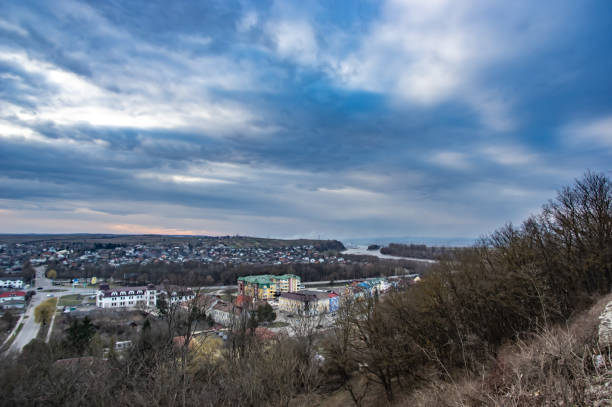 istock Clouds in the sunset sky over the city 1136773811