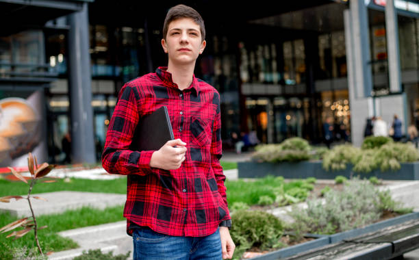 istock Teenage boy caring laptop 1136776566
