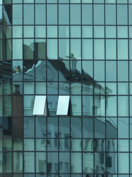 istock Reflection of old building in modern building 1136776769
