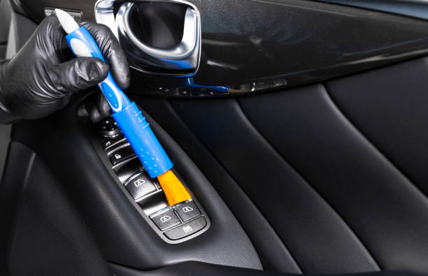 istock A man cleaning car with microfiber cloth and brush. Car detailing. Valeting concept. Selective focus. Car detailing. Cleaning car with brush. Worker cleaning. Car cleaning concept solution to clean. 1136776887
