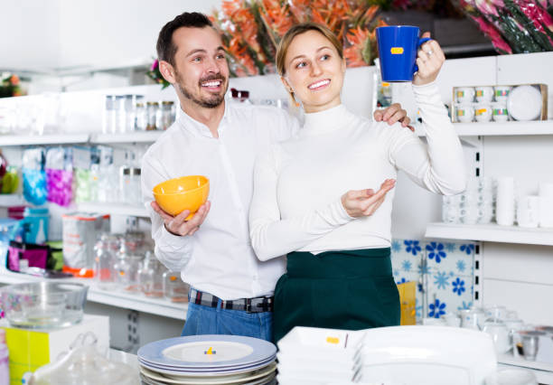 istock Couple selecting crockery in store 1136778332