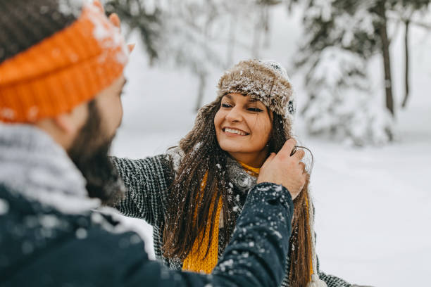istock Couple in the snow playing 1136778613