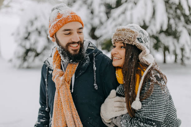 istock Couple in the snow playing 1136778617