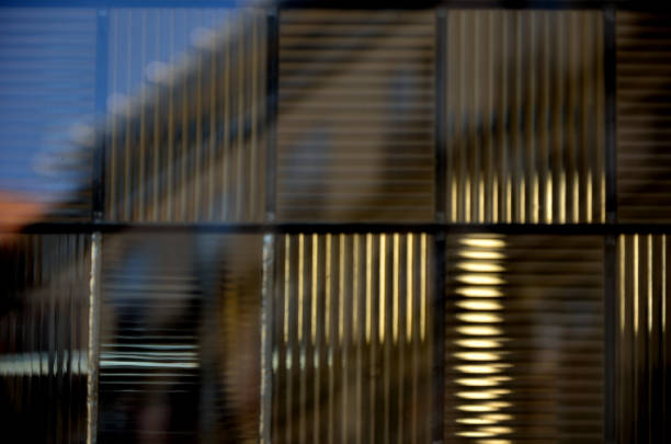istock Light reflection of building in glass facade 1136778662