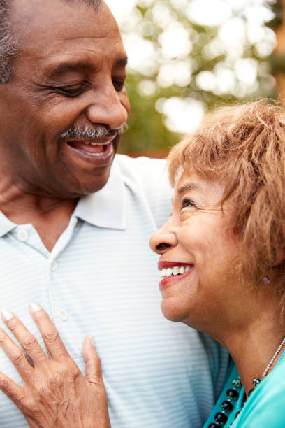 istock Senior black husband and wife embracing, close up, vertical 1136780016