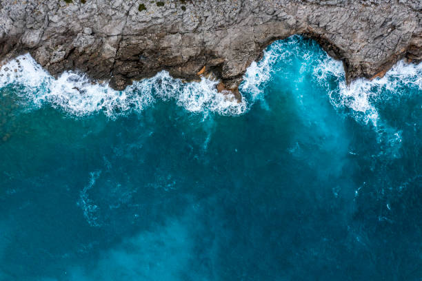 Sea waves hitting the rocky shore.