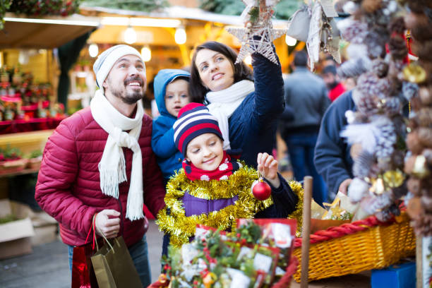istock Family purchasing Christmas decoration 1136783287