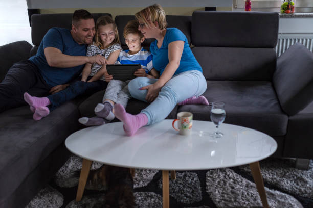 istock Family enjoying free time on the sofa 1136784693