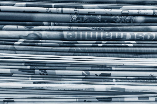 istock Blue monochrome abstract background of newspaper stack 1136785741