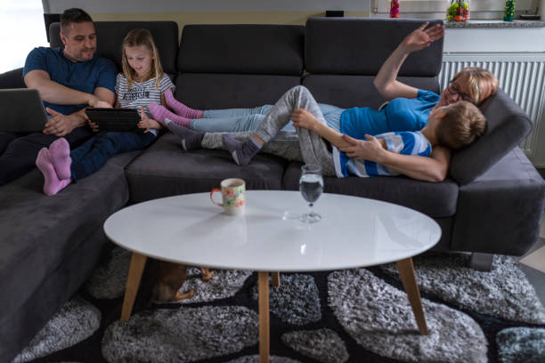 istock Family enjoying free time on the sofa 1136785886