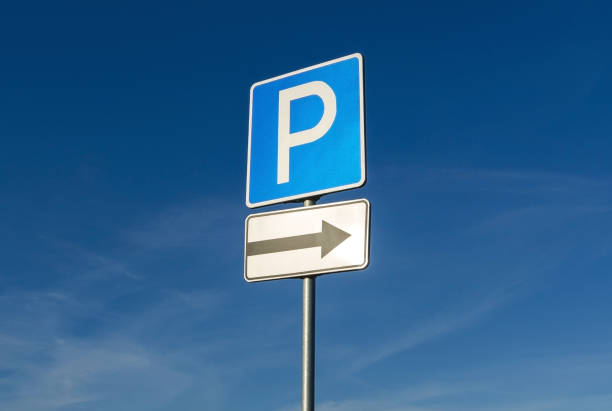 istock Parking sign on blue sky background 1136786123