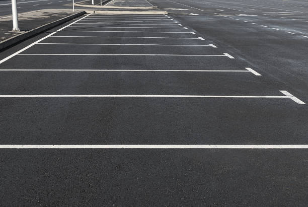 Empty parking lot outdoor with white marking lines