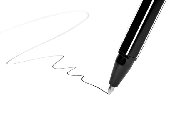 istock Writing ball pen on white paper 1136786274