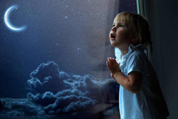 istock the child is looking in the spring window 1136788963
