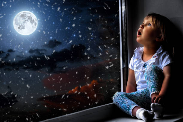 istock the child is looking in the spring window 1136789041
