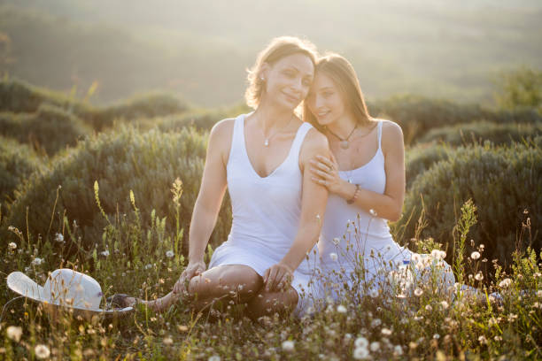 Best friends being cool and showing peace sign in the meadow, super happy and fun