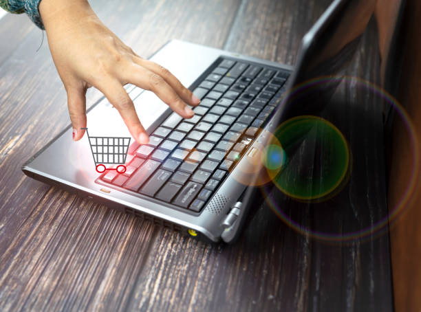 istock shopping cart and computer concept online shopping 1136789637