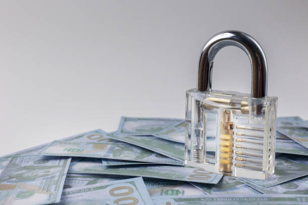 istock The clean padlock on money banknote close up. 1136789848