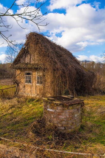 An abandoned traditional house in the small village of Suvoj in Sisak-Moslavina County, central Croatia. A well can be seen in the foreground