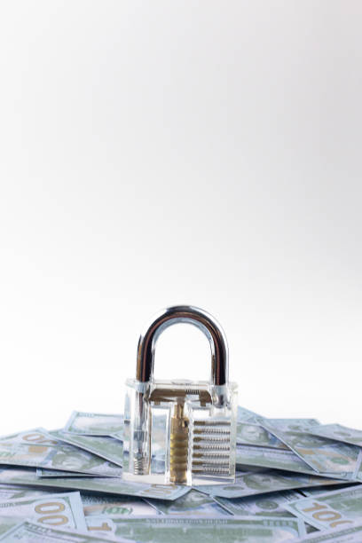 istock The clean padlock on money banknote close up. 1136789994