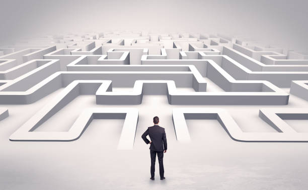 istock Businessman starting a flat 3d labyrinth 1136790559
