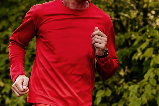 istock close-up man running in red sweatshirt 1136791036