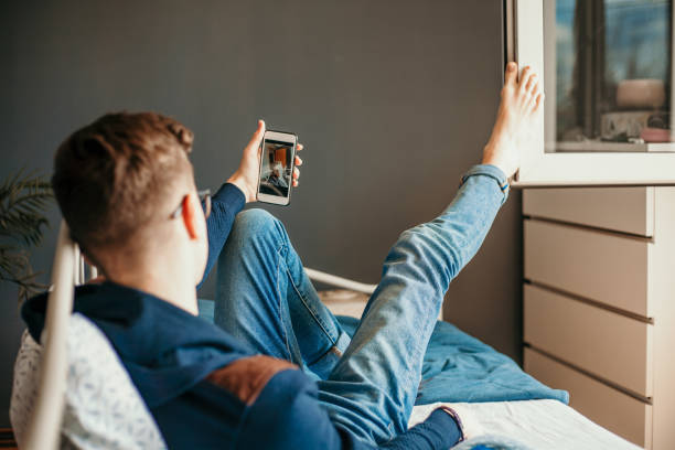 Teenage boy taking selfie