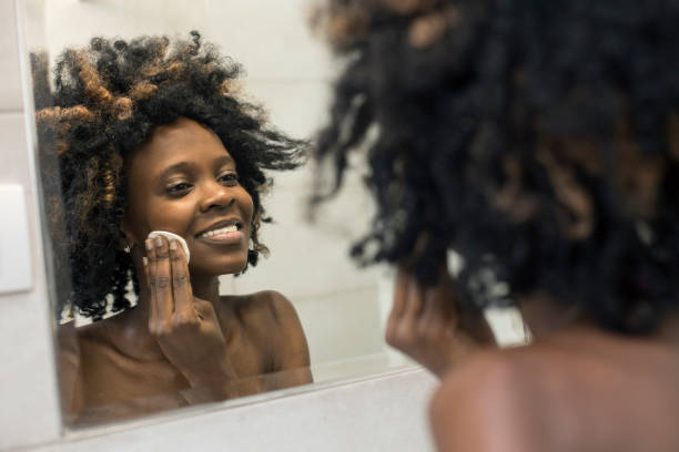 istock Young woman removing her make-up 1136793727