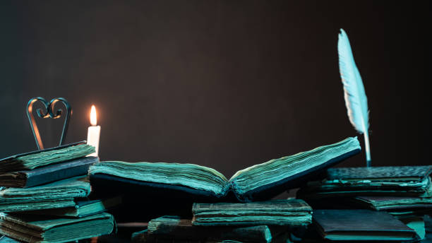 istock Stack Of Antique Books With Candlelight In Dark 1136793789