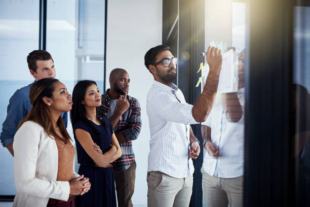 istock He's showing them a new way of doing things 1136793813