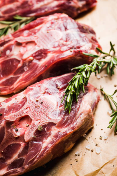 istock Raw meat with salt and spices on the rustic background 1136794618