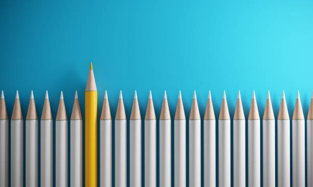 istock Orange Colored Pencil Standing Out From The Crowd 1136794737