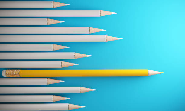 istock Orange Colored Pencil Standing Out From The Crowd 1136795219